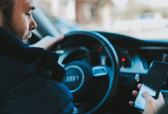 Man driving distracted on phone