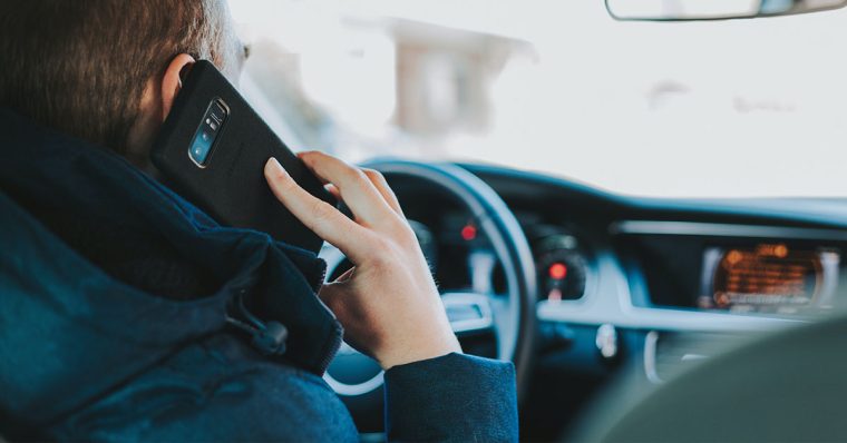 Man driving while on phone