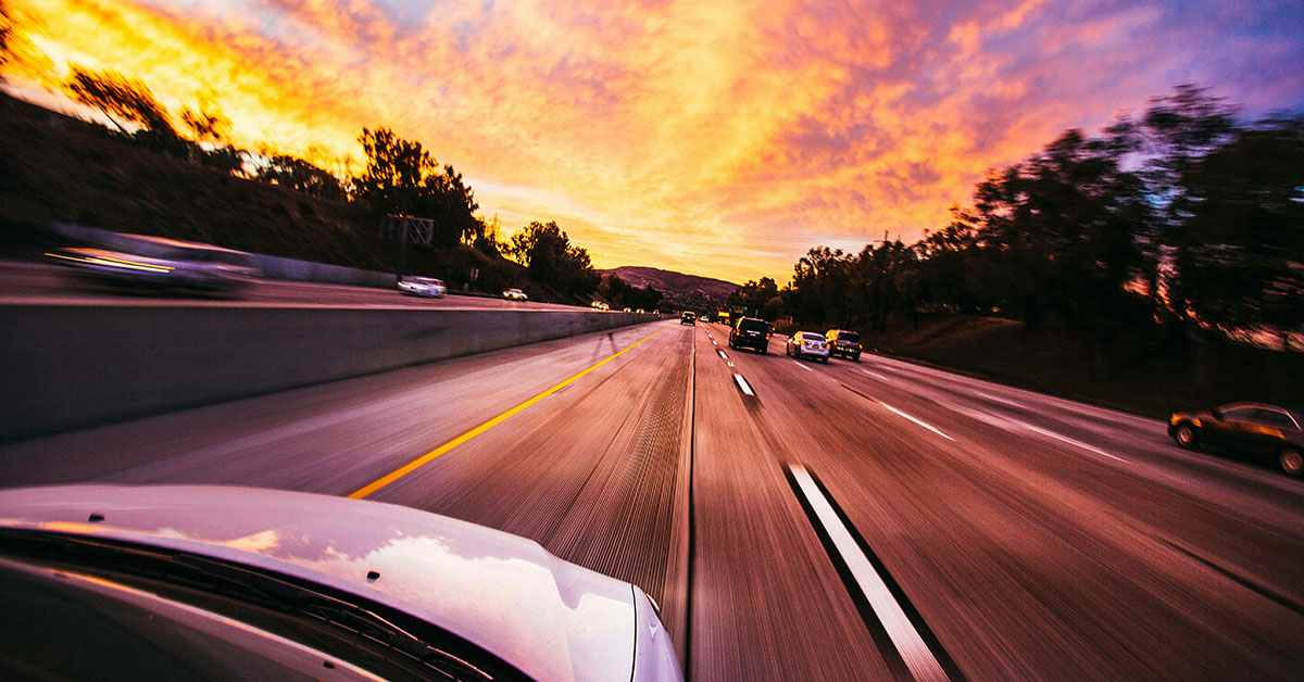 Driving on the highway during sunset