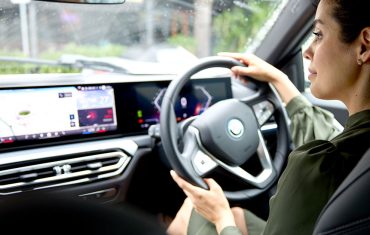 lady-in-green-dress-driving-car-on-the-road