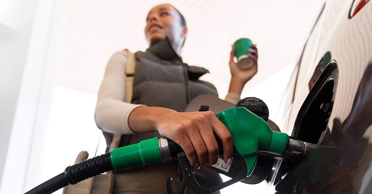 view-woman-with-car-gas-station